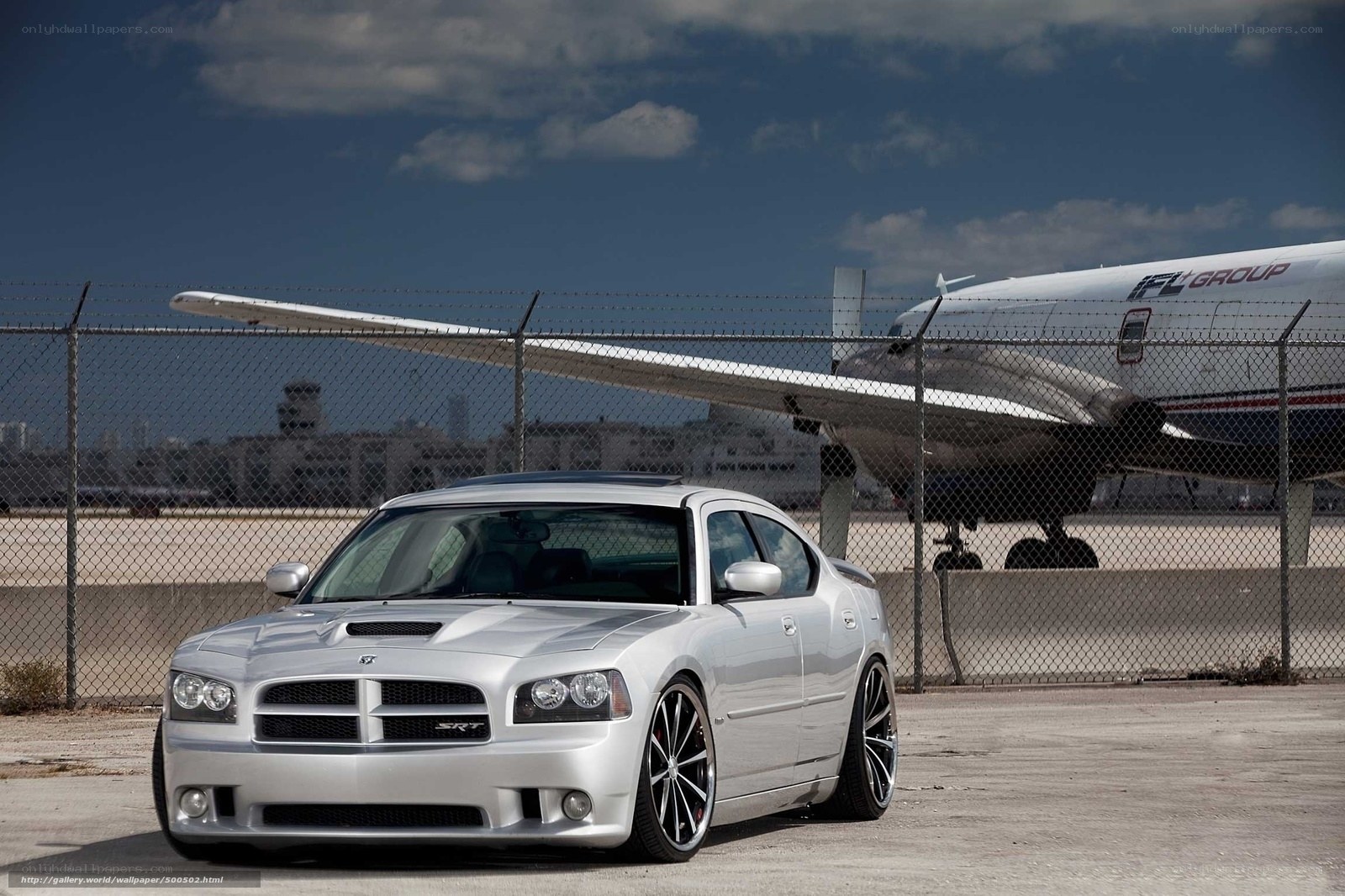 Silver Dodge SRT-8 at airport