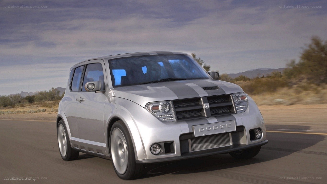 Silver Dodge SUV on desert road