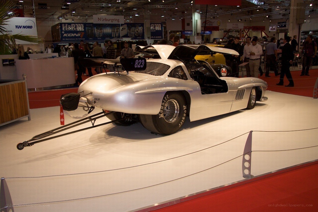 Silver drag racing car on display
