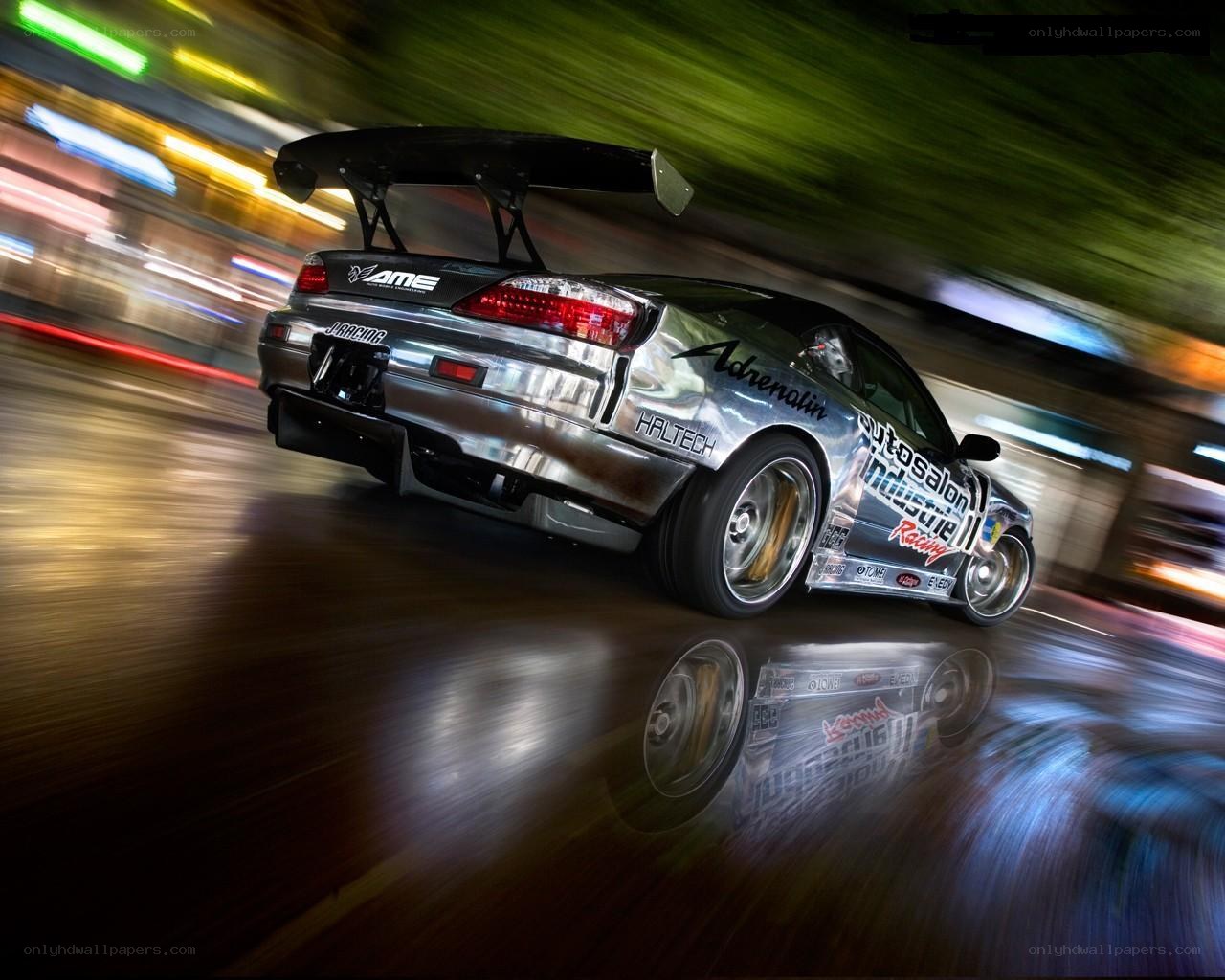 silver drift car at night
