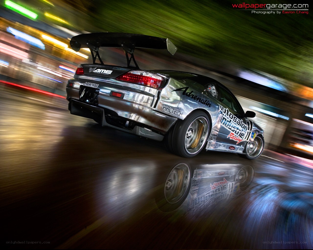 silver drift car at night