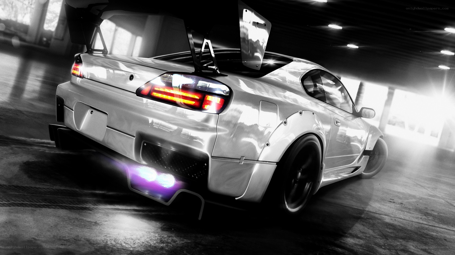 silver drift car in garage