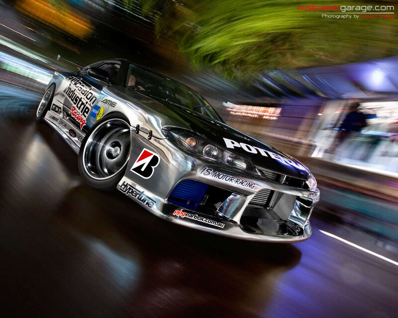 silver drift car in motion