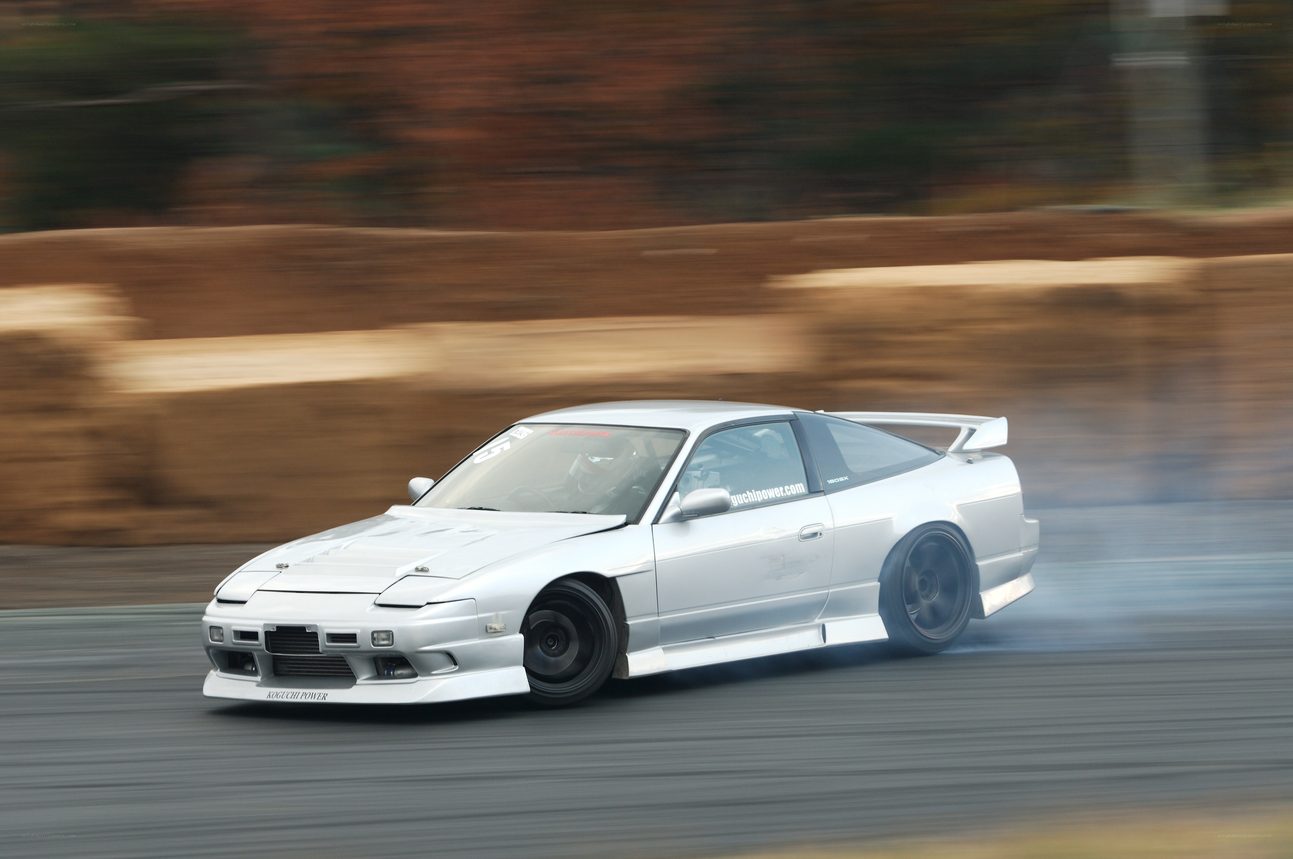 Silver drift car on track