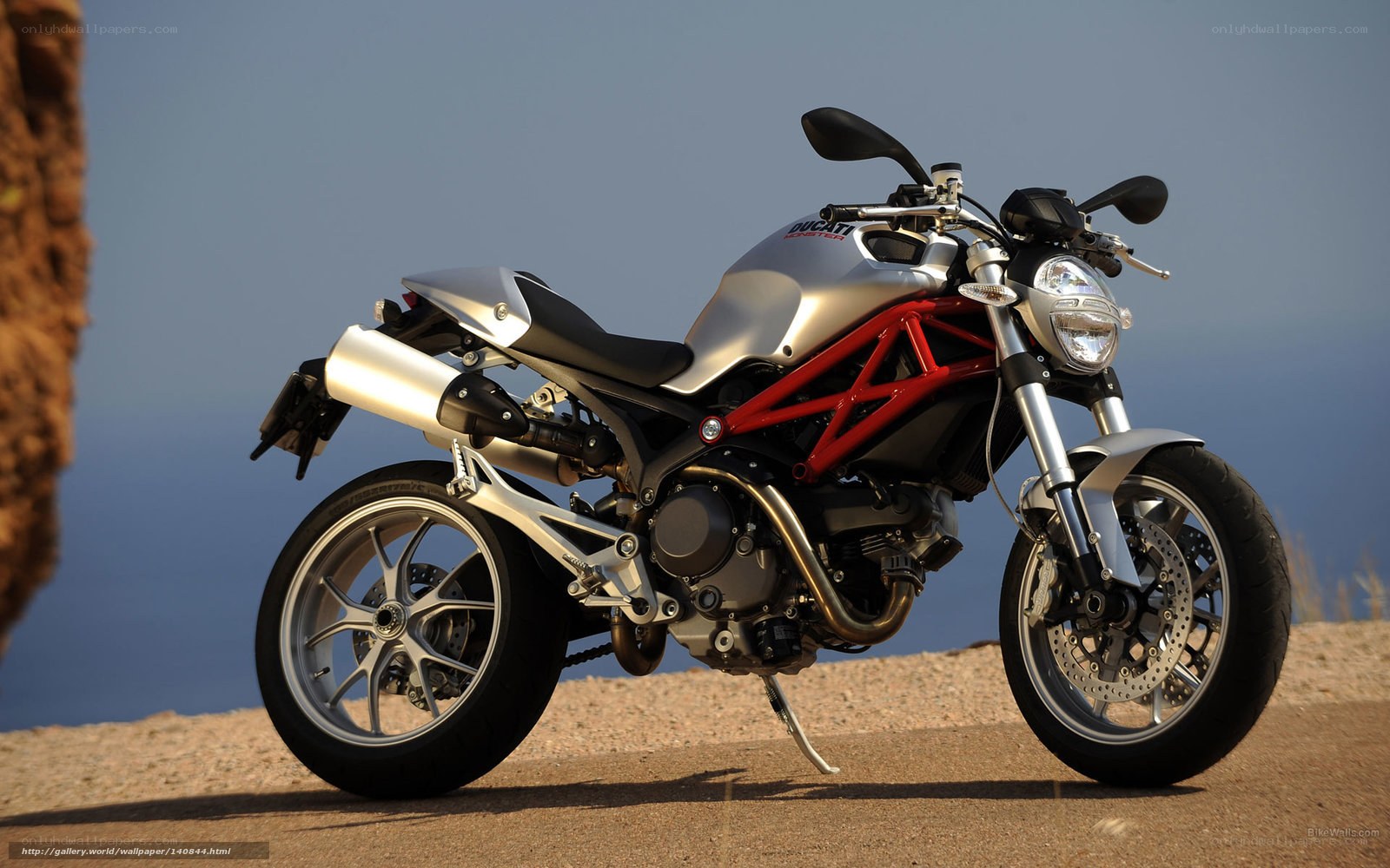 Silver Ducati motorcycle on cliff