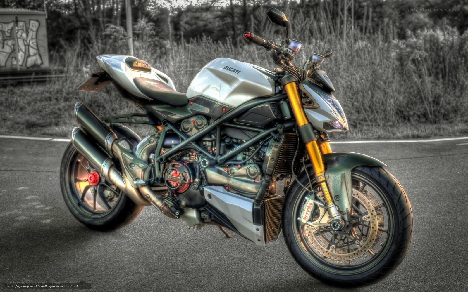 Silver Ducati motorcycle on road