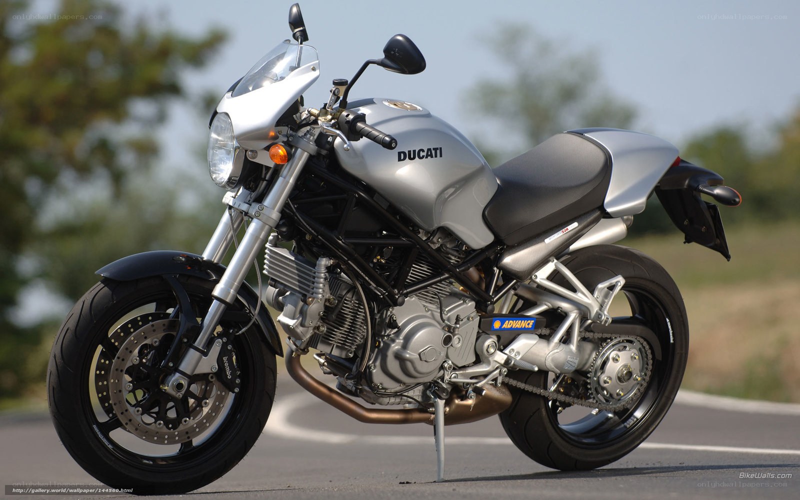 Silver Ducati motorcycle on road