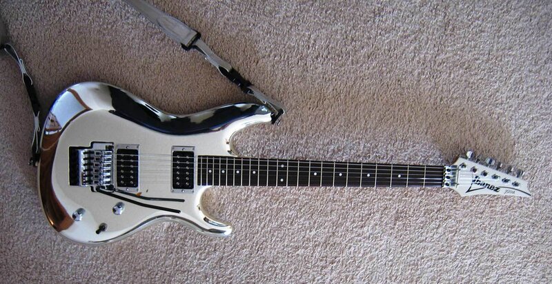 silver electric guitar on carpet