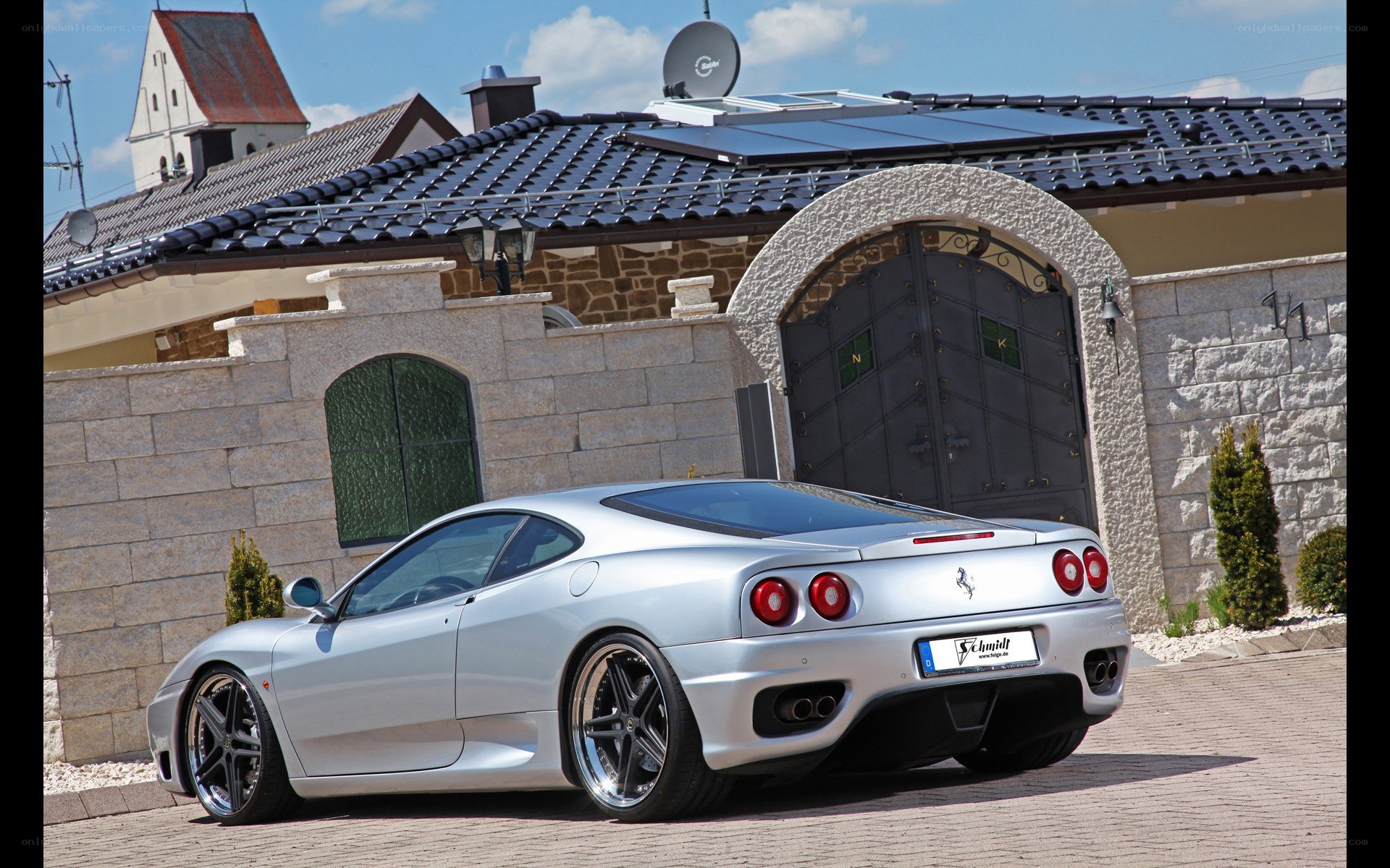 Silver Ferrari 360 parked outside