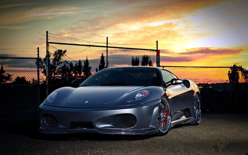 silver ferrari at sunset