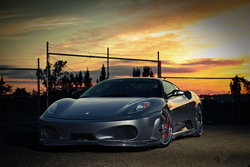 silver ferrari at sunset