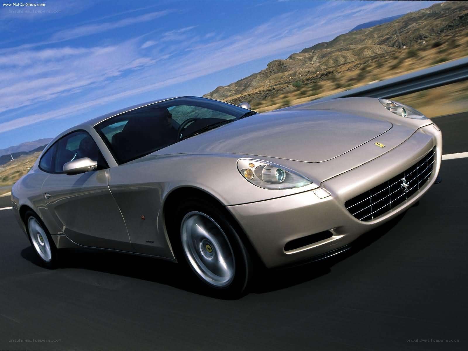 silver ferrari car on road