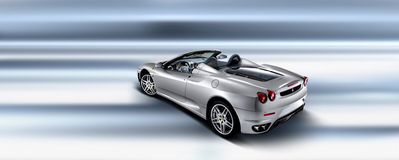 Silver Ferrari Convertible — Dynamic