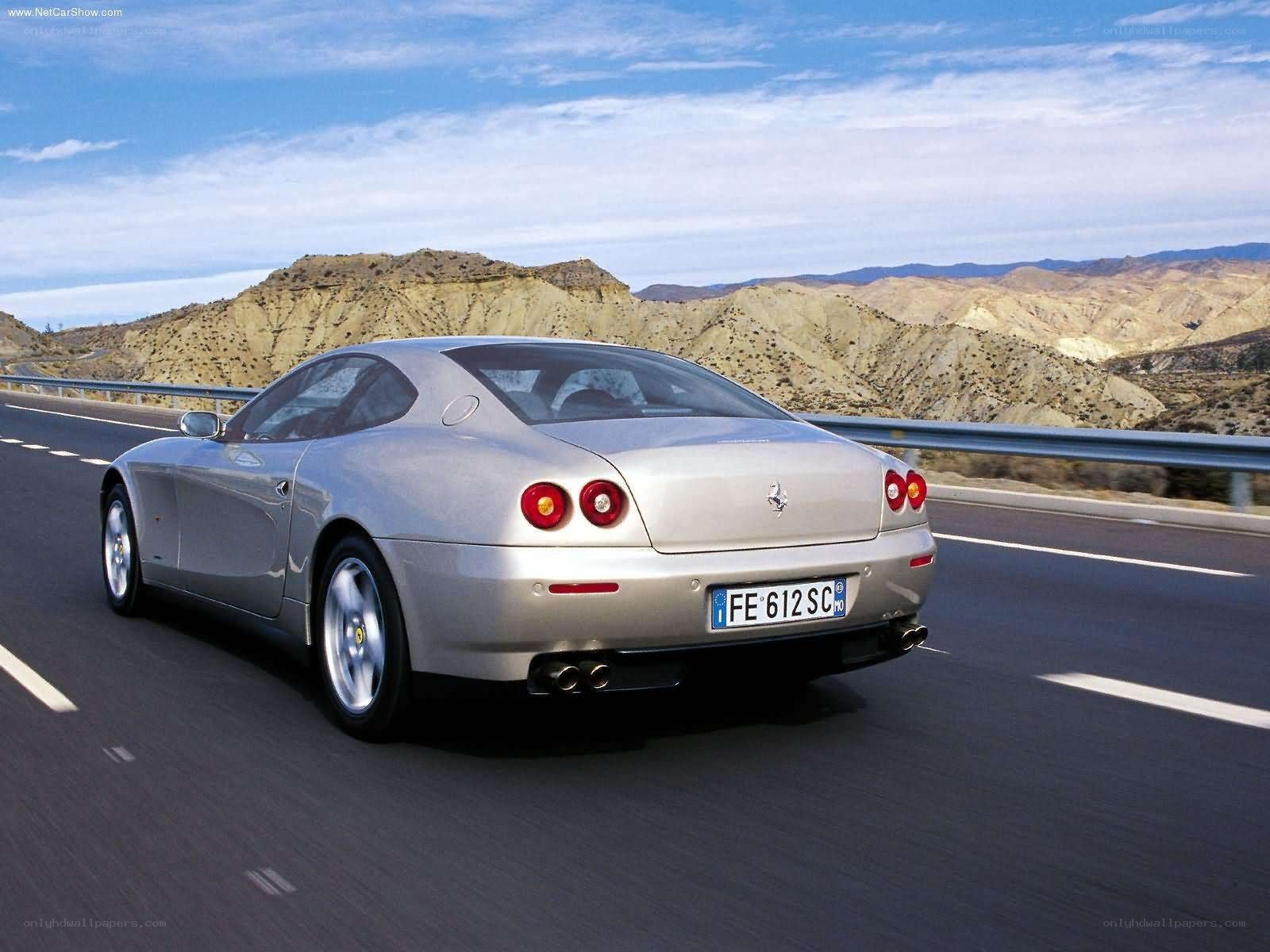 silver ferrari driving on highway
