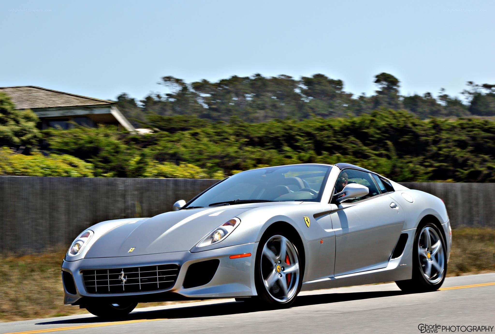 Silver Ferrari driving on road