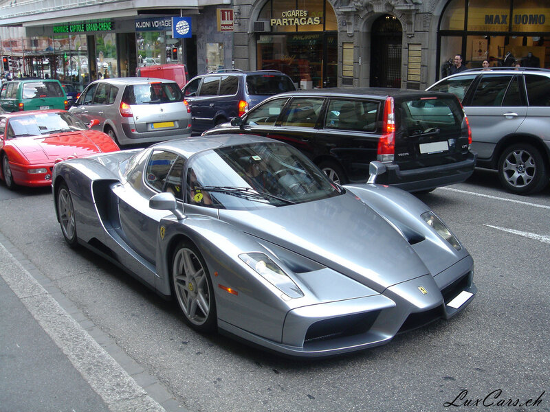 Silver Ferrari Enzo on city street
