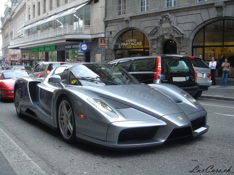 Silver Ferrari Enzo on city street