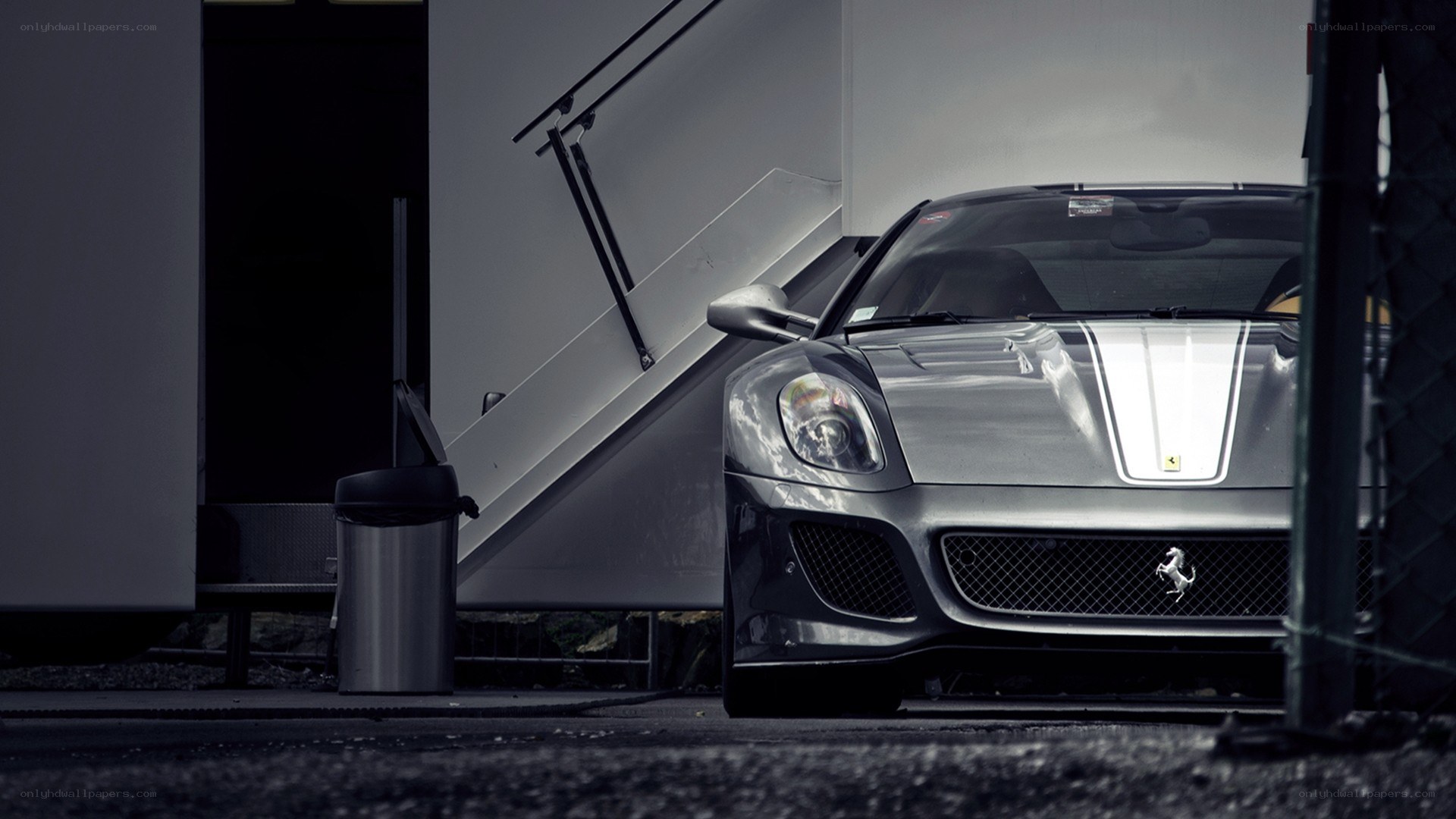 Silver Ferrari in a garage