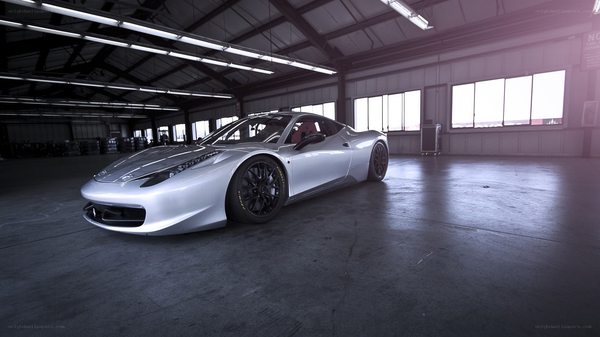 Silver Ferrari in a garage