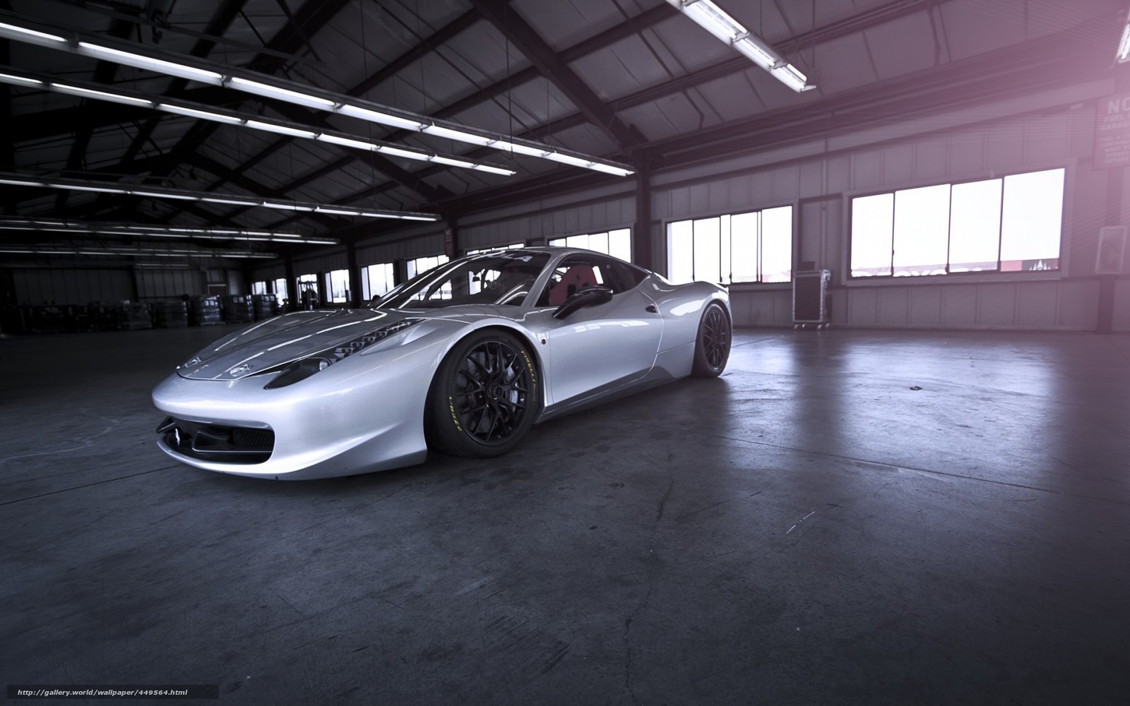 Silver Ferrari in a warehouse