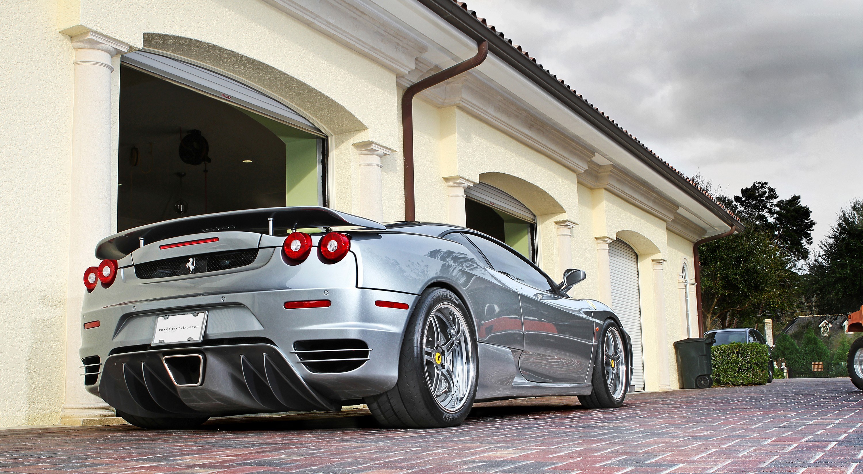 silver ferrari in driveway