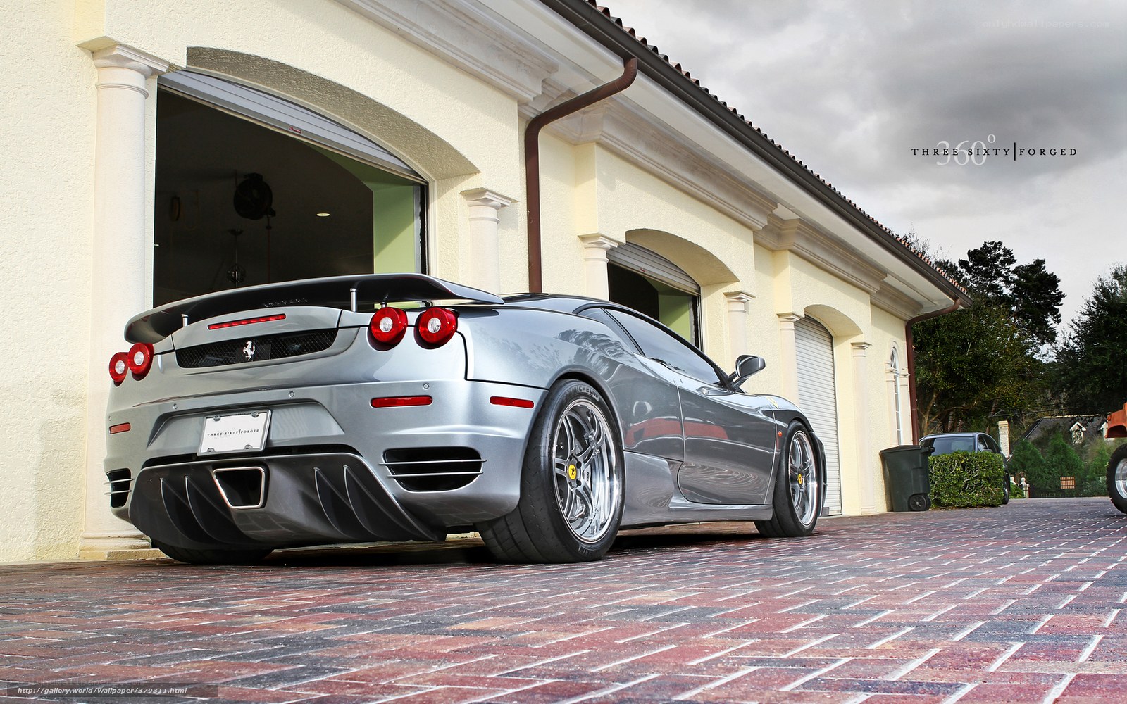 Silver Ferrari in driveway