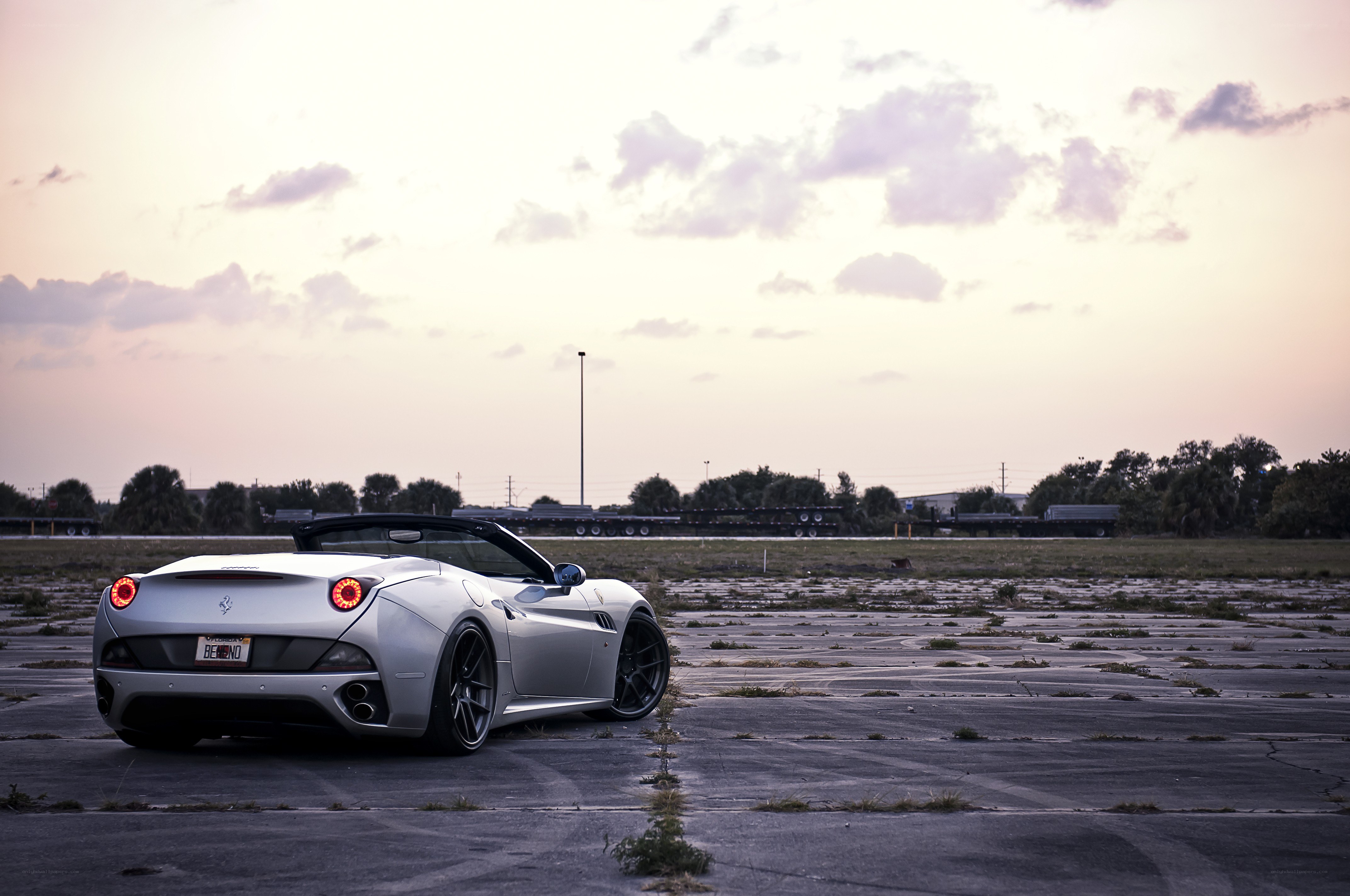 silver ferrari in empty lot