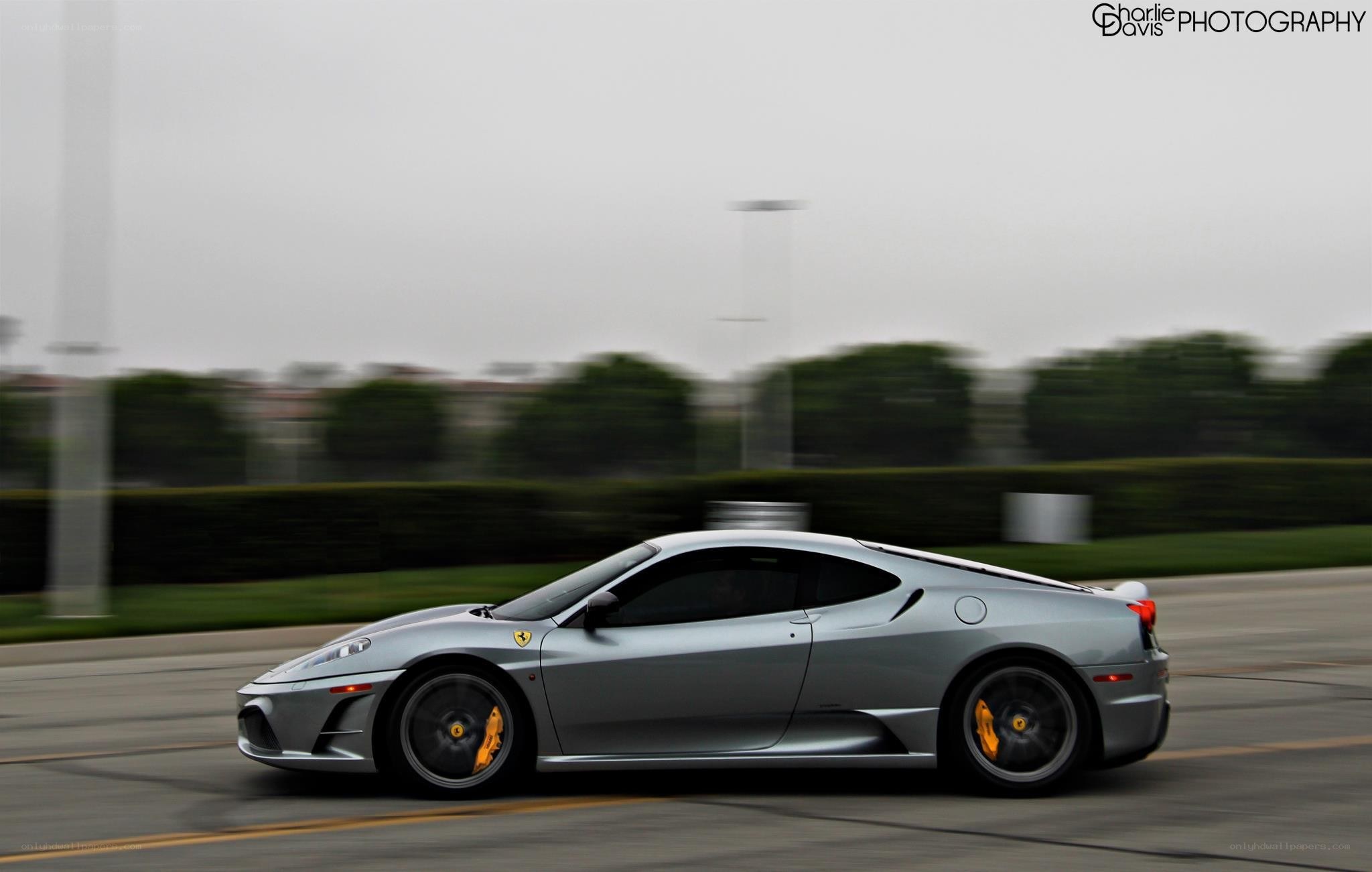 silver ferrari in motion