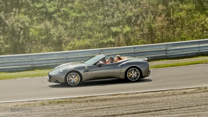 Silver Ferrari on a racetrack
