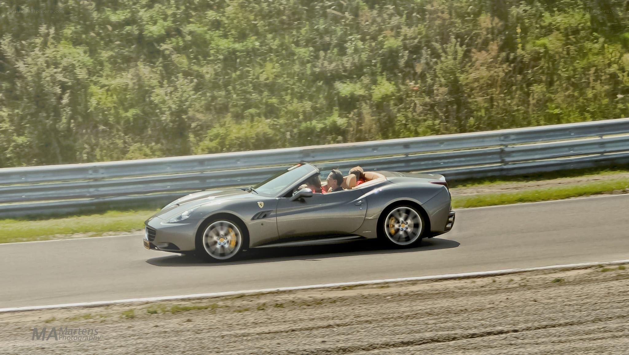Silver Ferrari on a racetrack