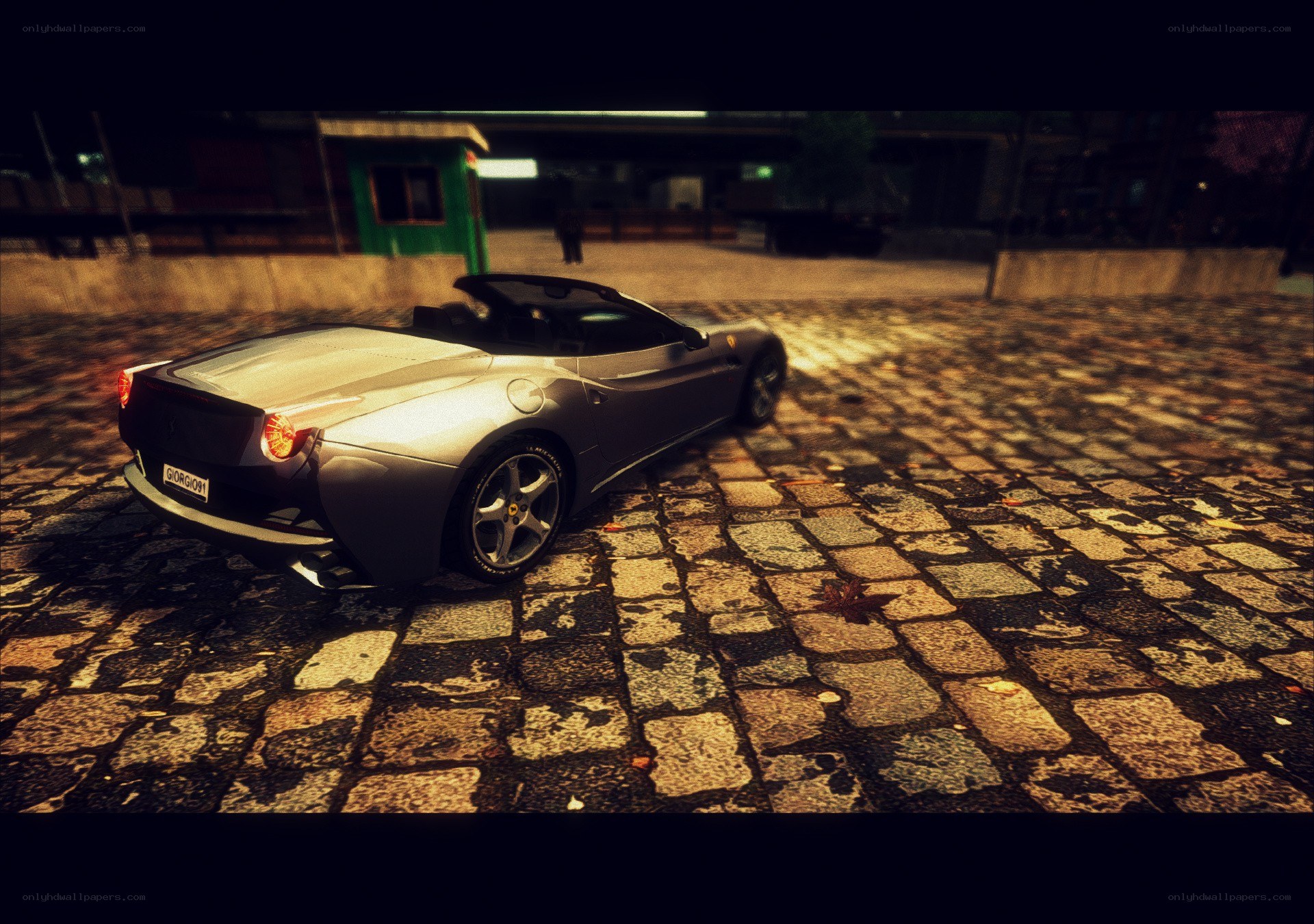 Silver Ferrari on cobblestones