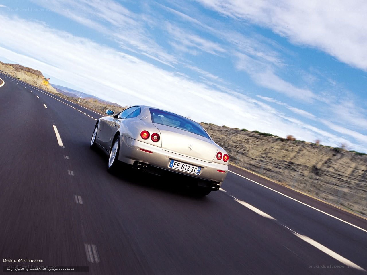 silver ferrari on desert road