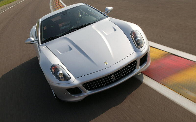 silver ferrari on racetrack