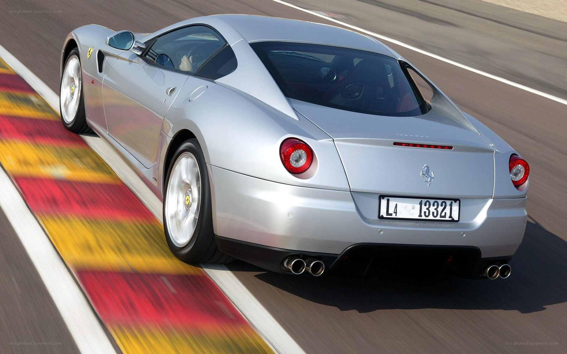 silver ferrari on racetrack