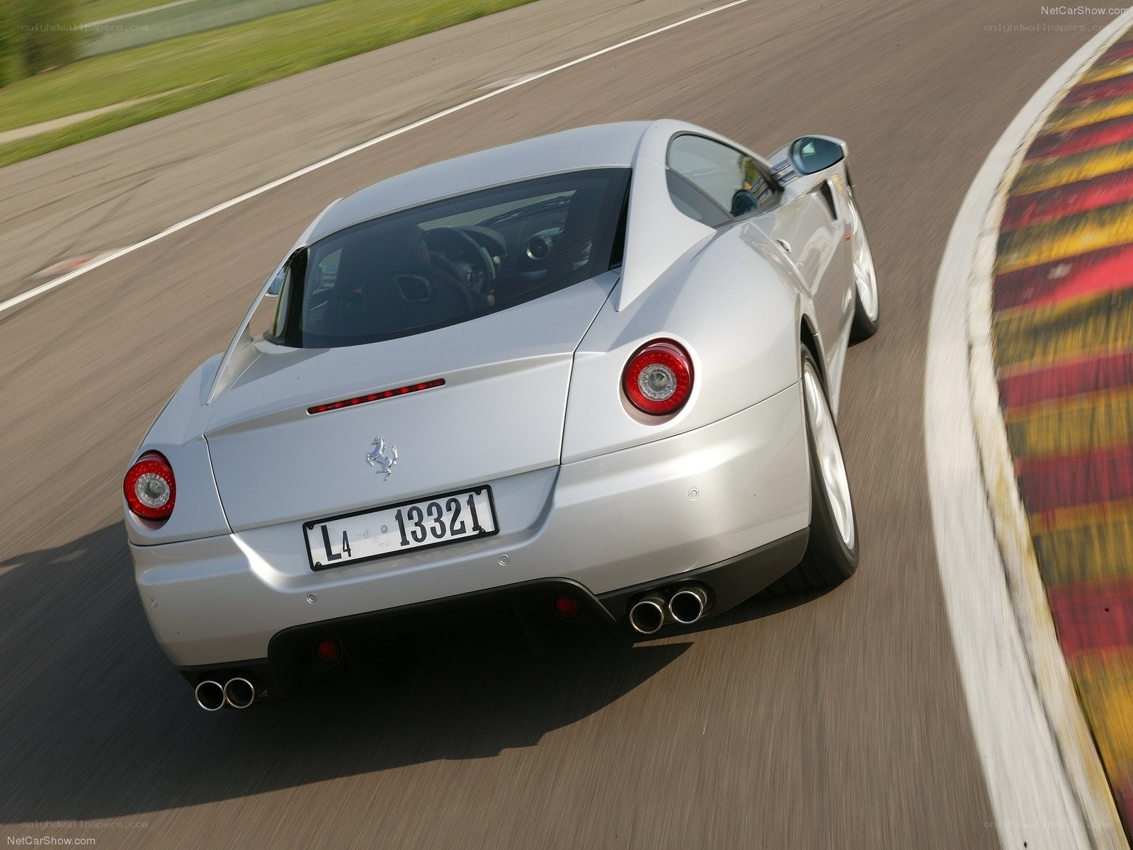 silver ferrari on racetrack