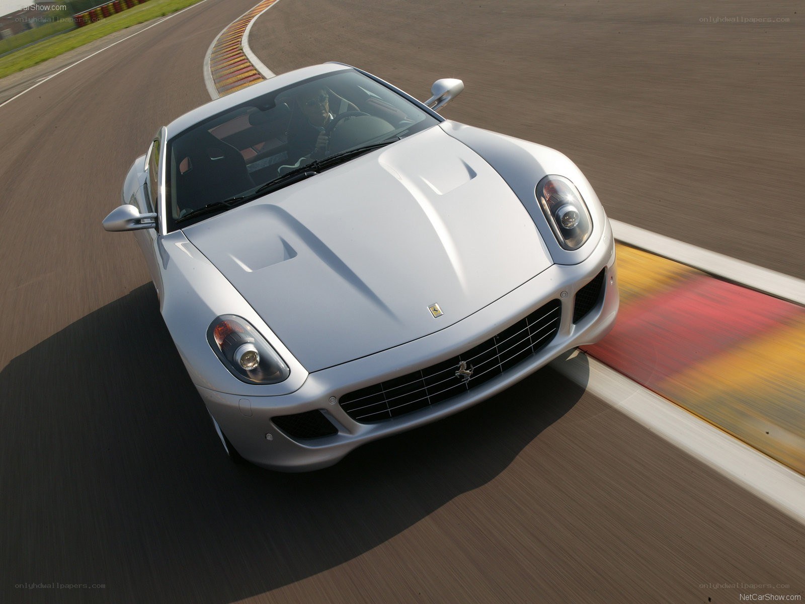 silver ferrari on racetrack