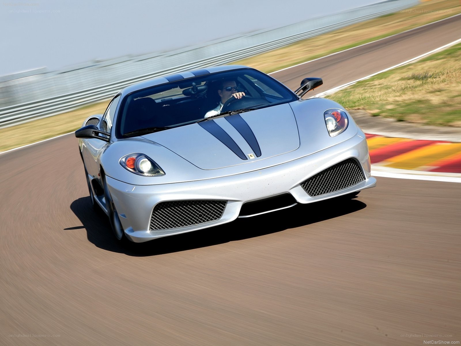 silver ferrari on racetrack