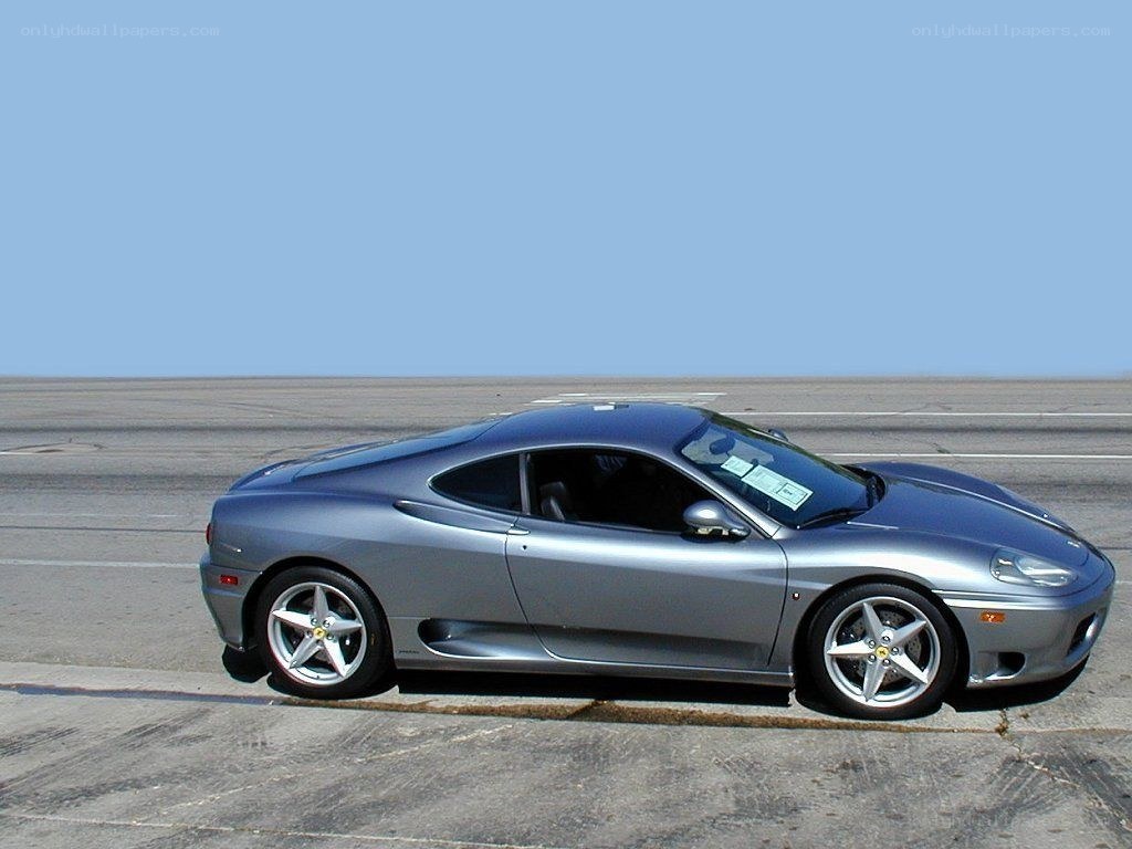 silver ferrari on tarmac