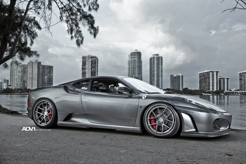 silver ferrari on waterfront
