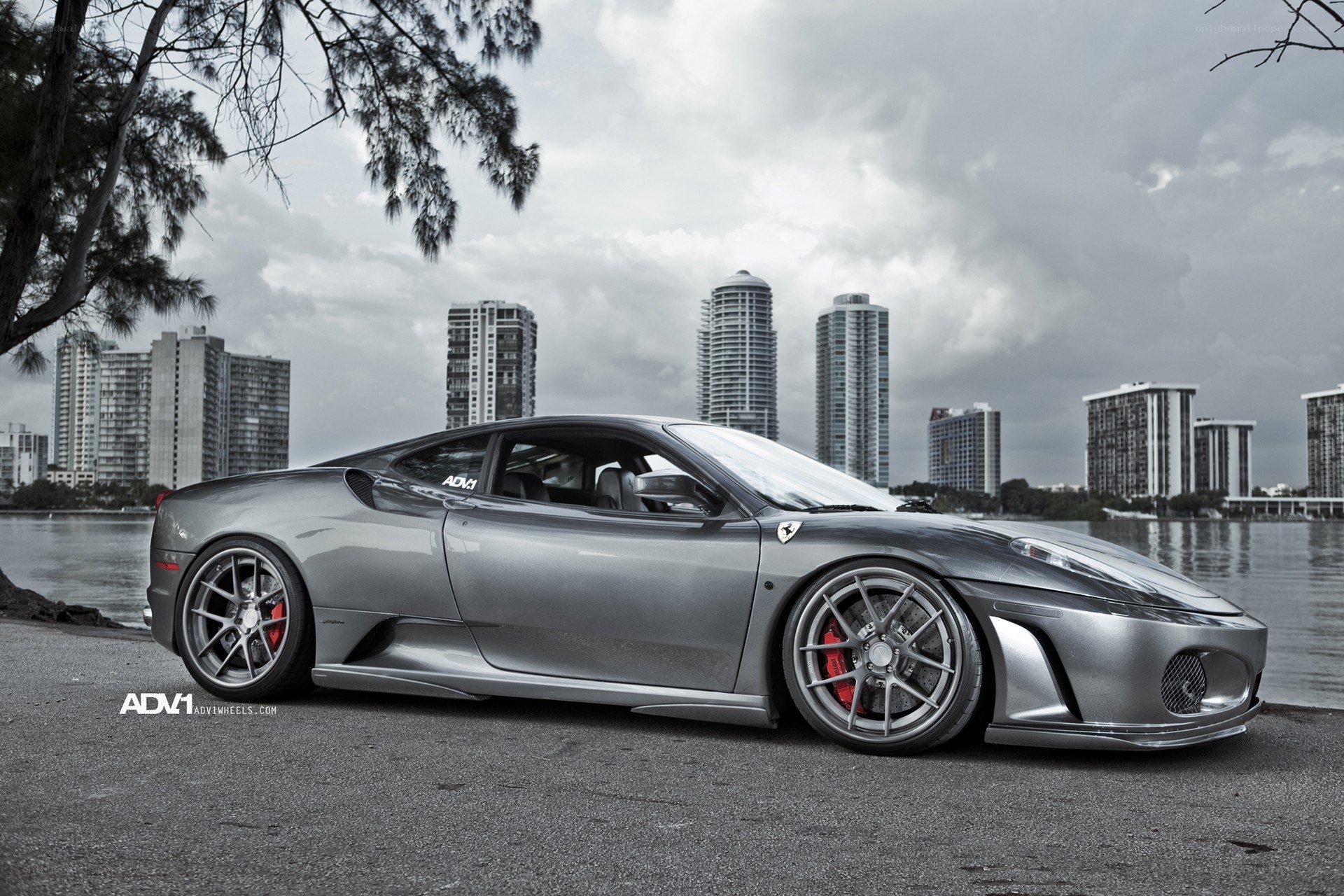 silver ferrari on waterfront
