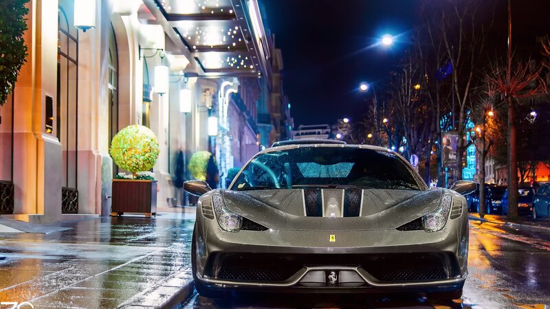 Silver Ferrari on Wet Street