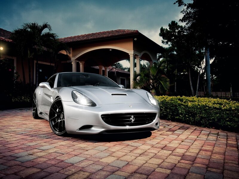 Silver Ferrari parked at a house
