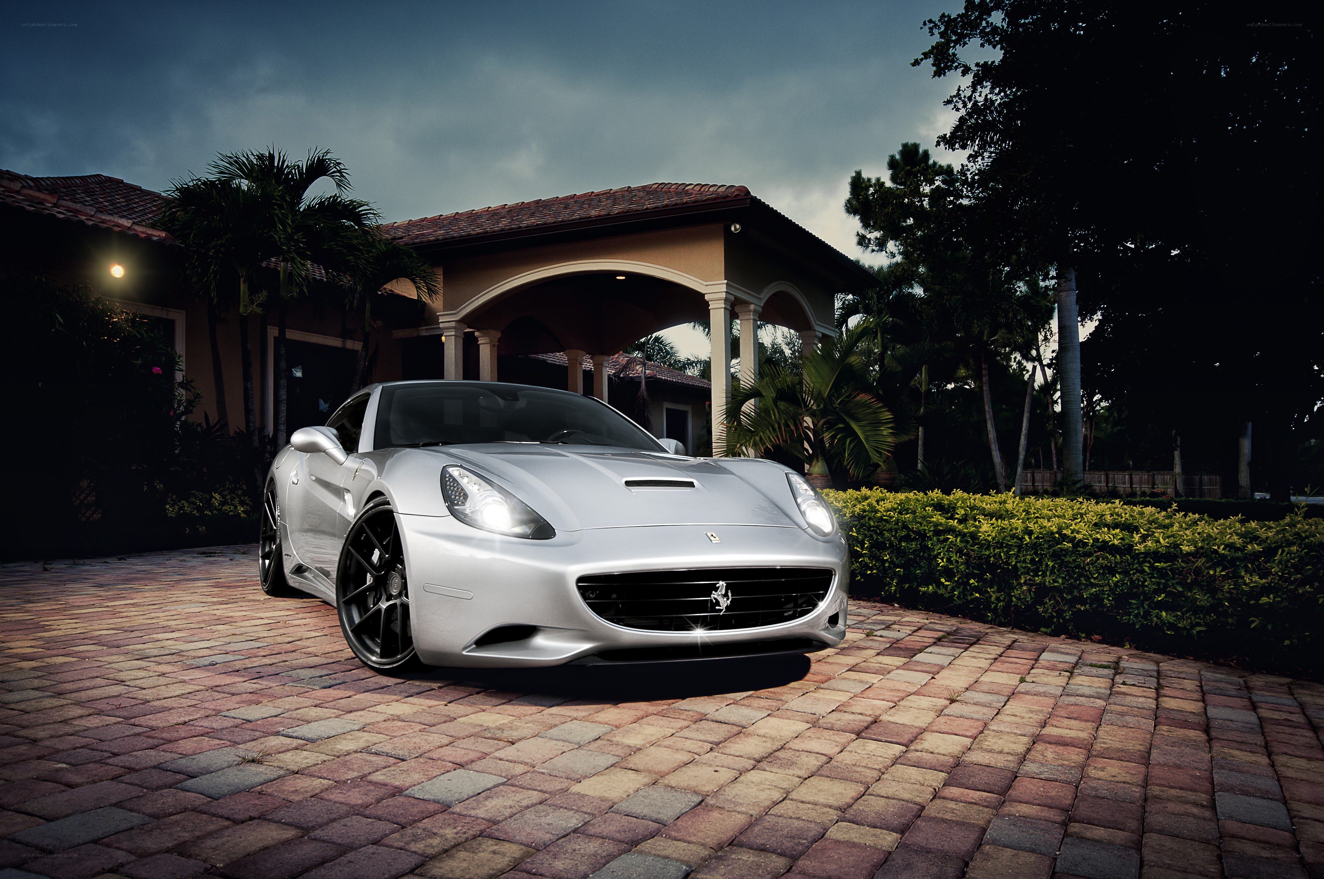 Silver Ferrari parked in driveway