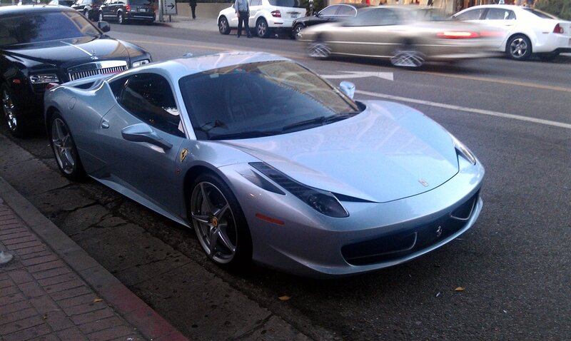 Silver Ferrari parked on street