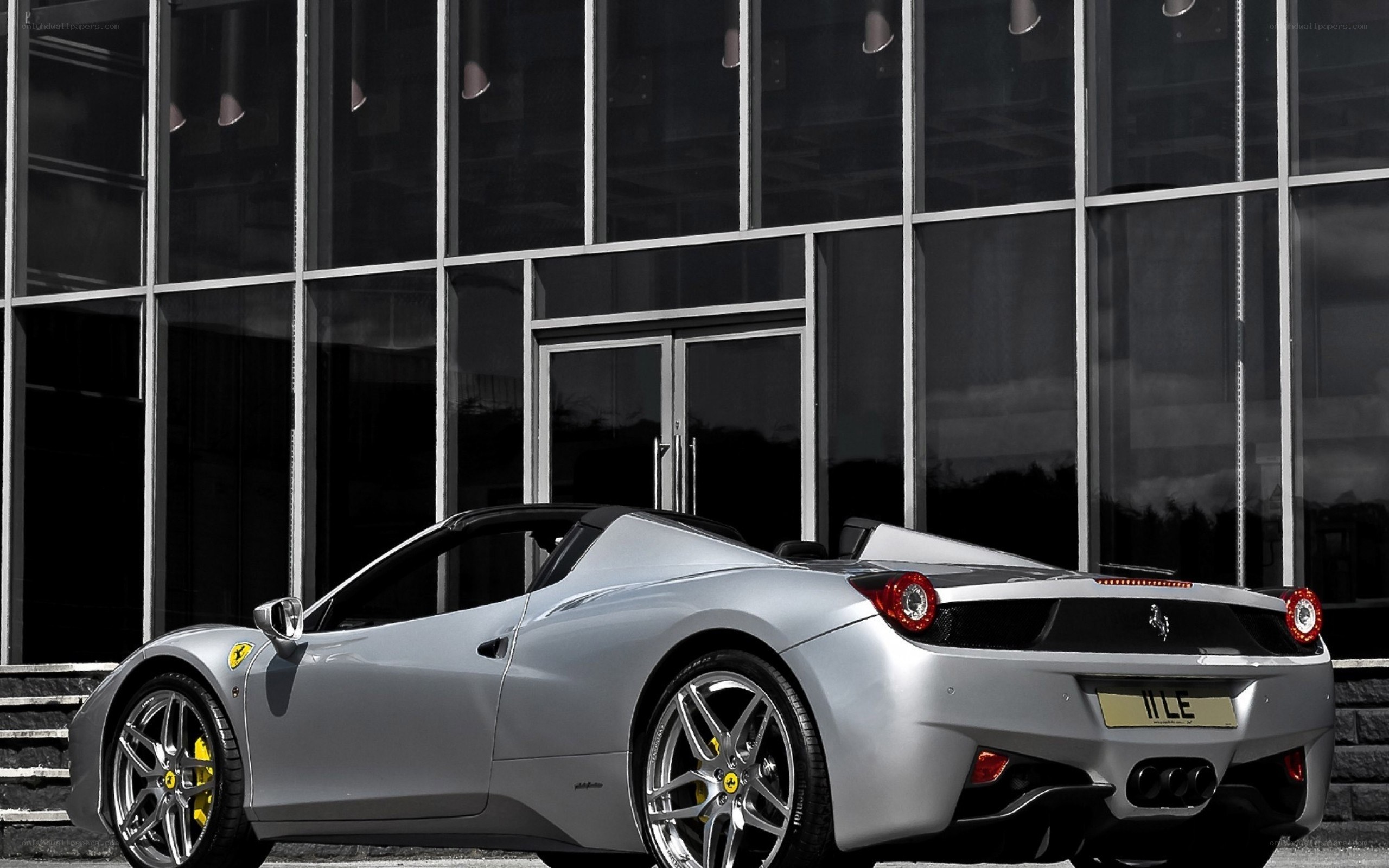 Silver Ferrari parked outside