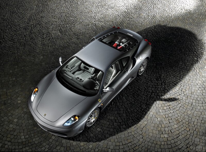 Silver Ferrari with engine view