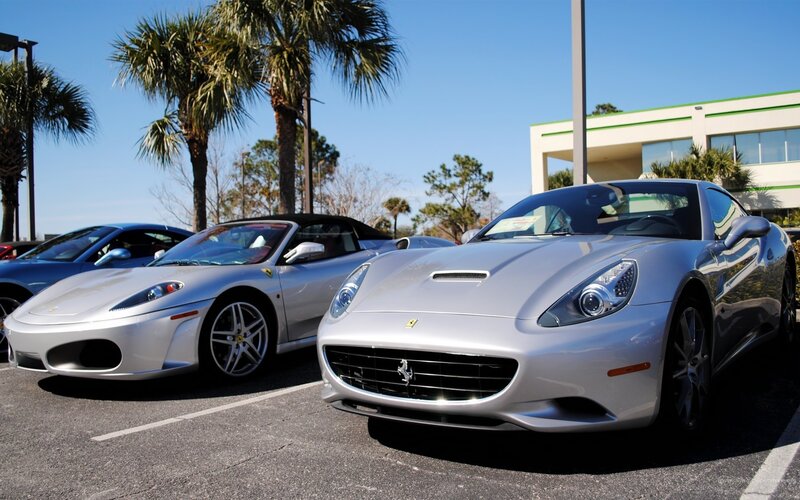 Silver Ferraris in parking lot