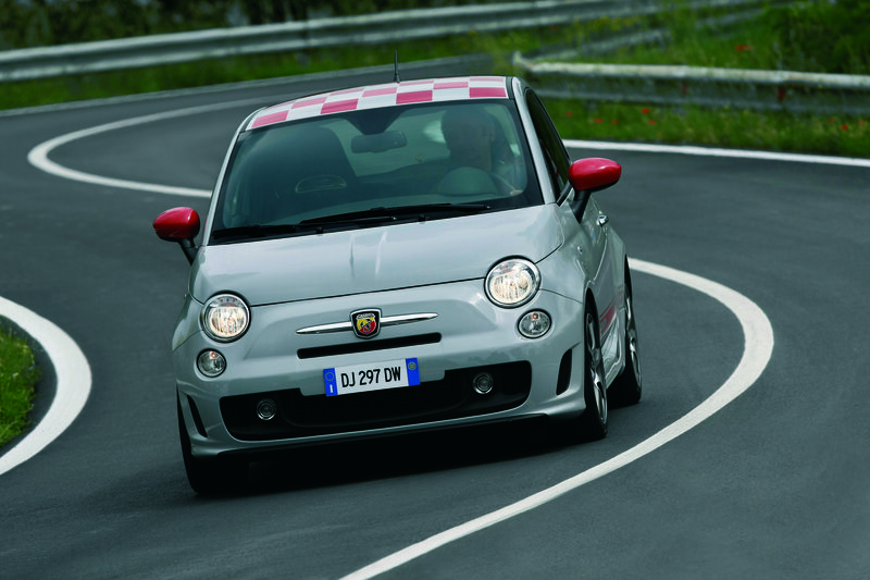 Silver Fiat 500 Abarth on winding road