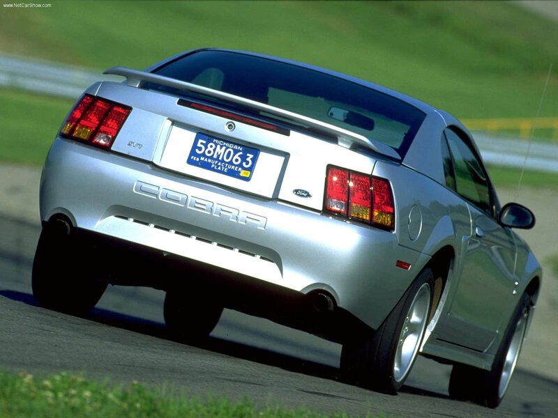 silver ford cobra on track