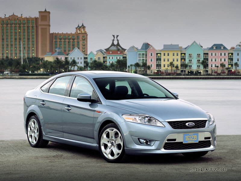 silver ford fiesta parked by water